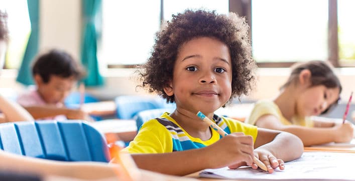 A student taking part in a class discussion