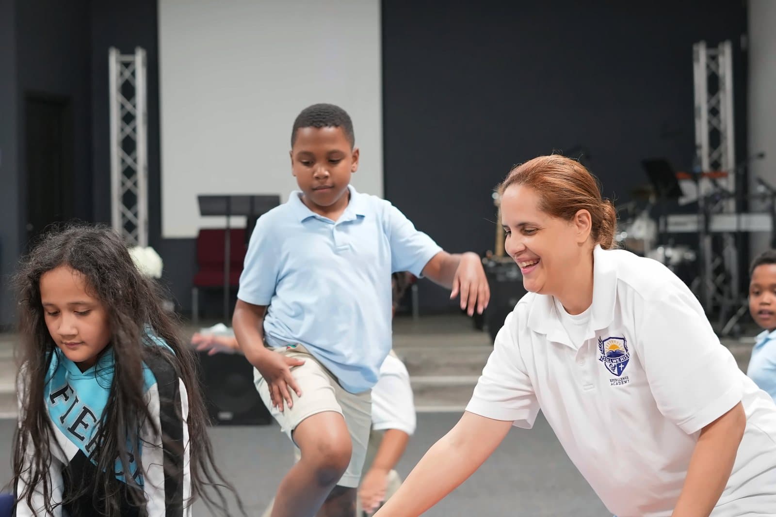SWREA students running and playing with Maestra Nuñez