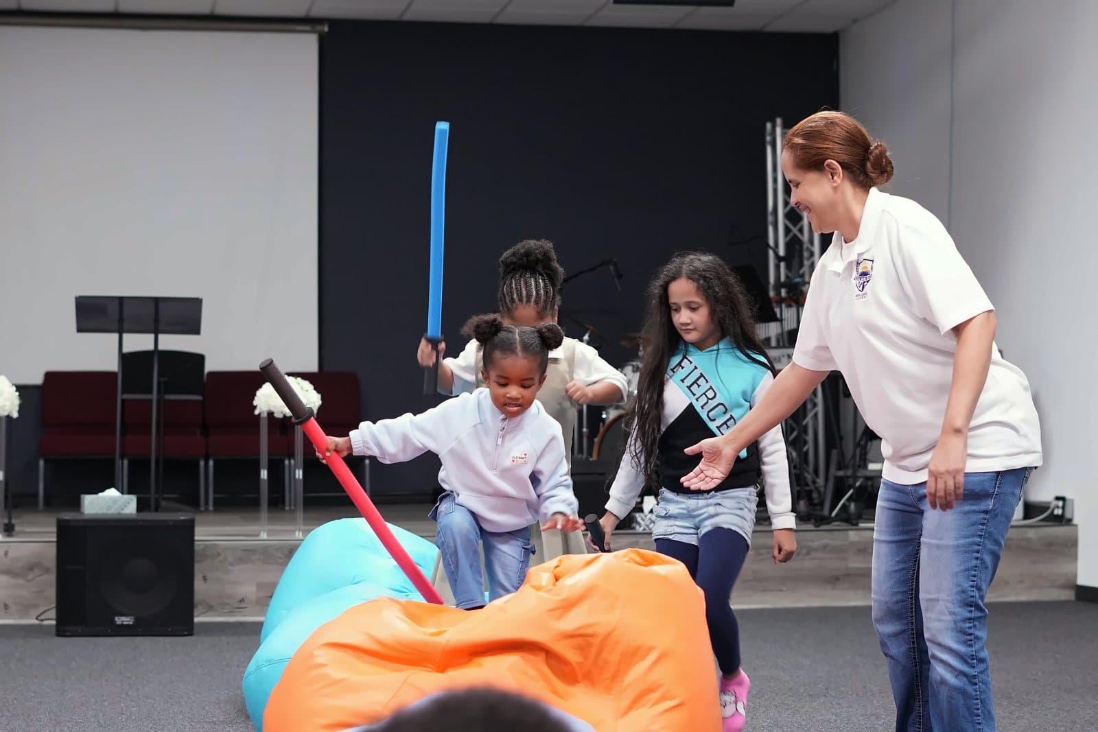 SWREA students on an obstacle course with their teacher